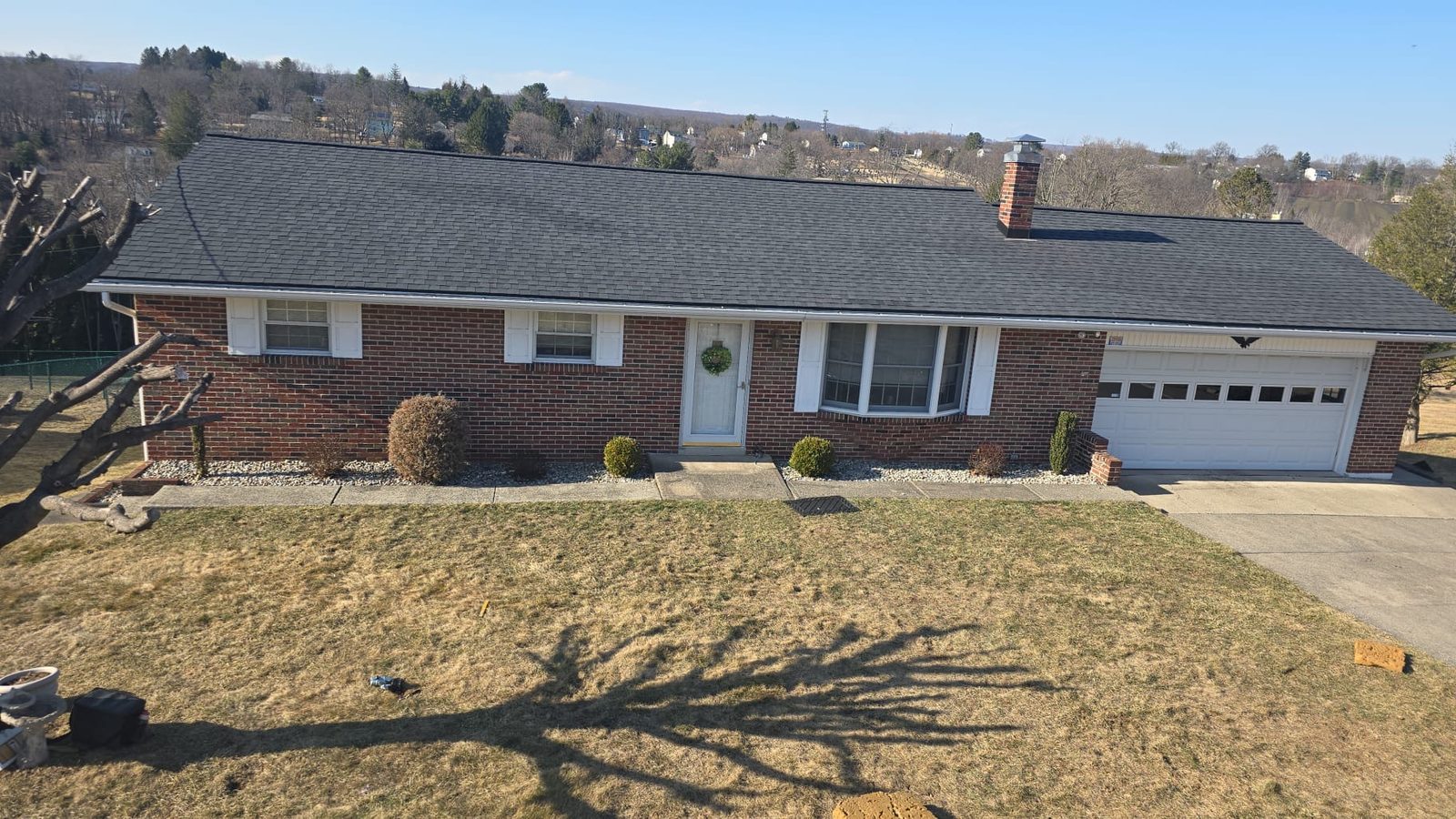 Brick ranch home in Sinking Spring, PA with a completed asphalt shingle roof replacement