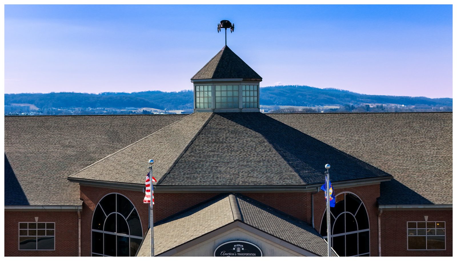 AACA Museum roof replacement, Hershey, PA — Roofline with mountain backdrop