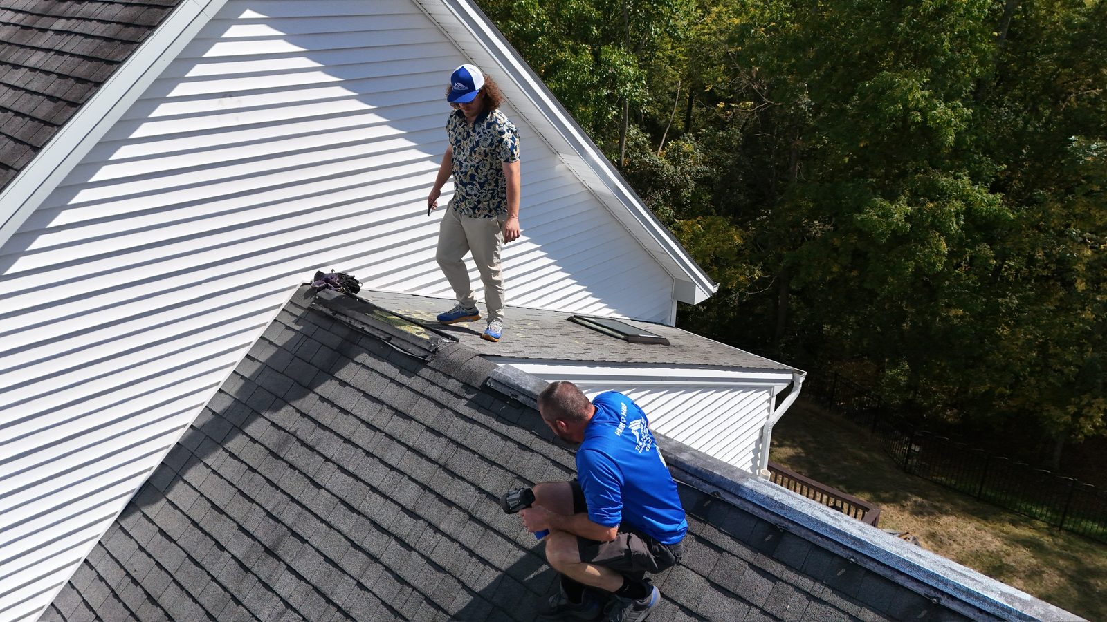 Roofing crew installing shingles at the ridge in Lebanon, PA