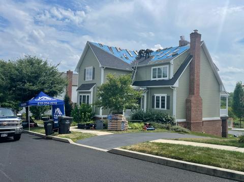 Blue roof tarp storm damage neighborhood — Pottstown, PA
