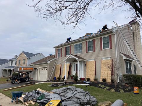 Brick twin home roof exterior jobsite — Phoenixville, PA