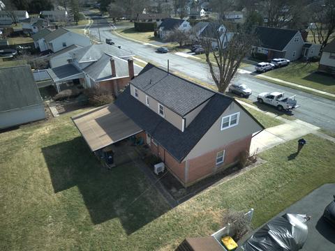 Drone view two-story home new roof
