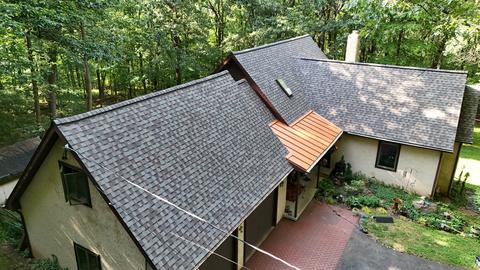 Drone home gray roof wooded — Mohnton, PA