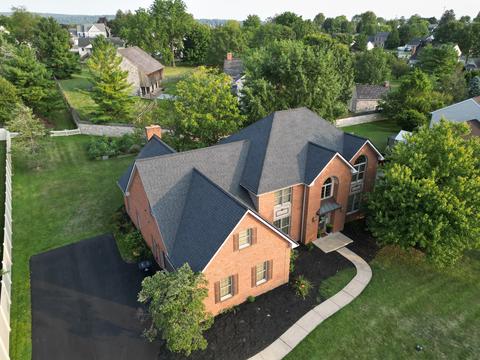 Drone view brick home gray roof landscaped — New Holland, PA