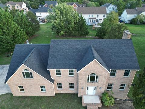 Drone view brick home new roof — Lebanon, PA