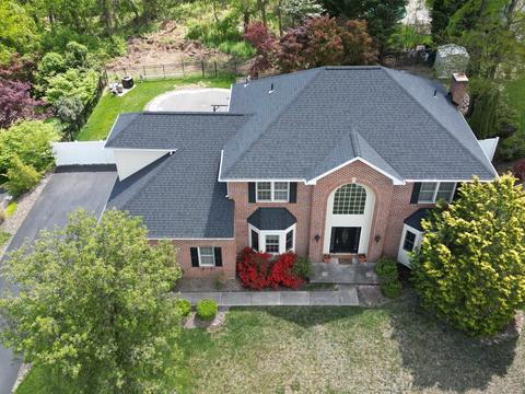 Drone view brick home roof replacement — Mohnton, PA