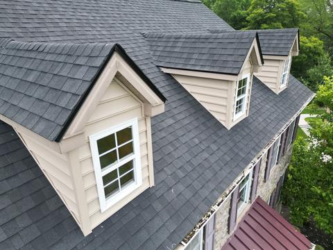 Drone view gray shingle roof dormers — Phoenixville, PA