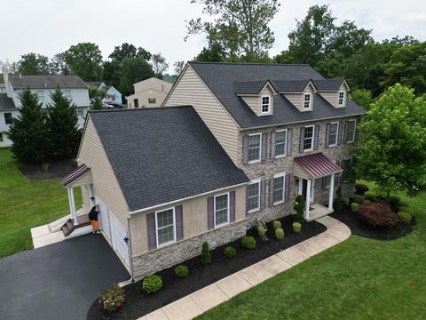 Drone view gray shingle roof multiple gables — Phoenixville, PA