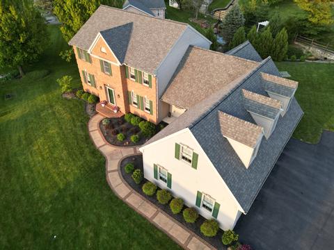 Drone view large brick home roof — New Holland, PA