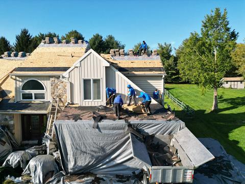 Drone view roof replacement crew dormers — New Holland, PA