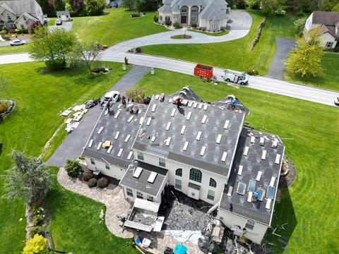 Drone view roof tear off exposed decking — Fleetwood, PA