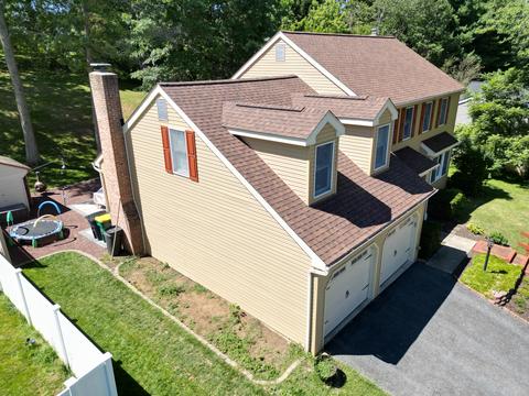Drone view tan home gray roof — Mohnton, PA