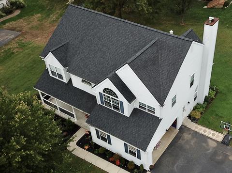 Drone view two story home gray roof — Phoenixville, PA