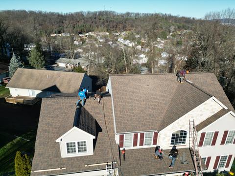 Drone view two story home new roof — Mohnton, PA