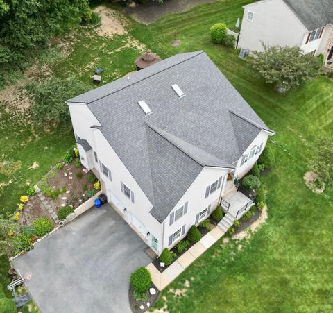Drone view two story home new roof — Mohnton, PA