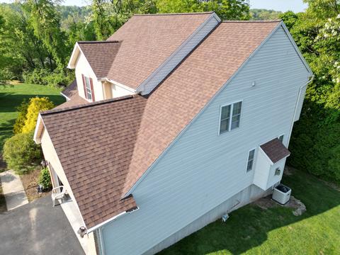 Drone view white home black roof — Mohnton, PA
