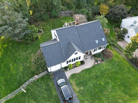 Drone view white home gray roof — West Chester, PA