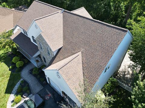Drone view white two story home roof — Mohnton, PA