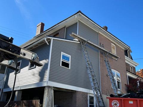 Gray two story home exterior new roof — Mohnton, PA