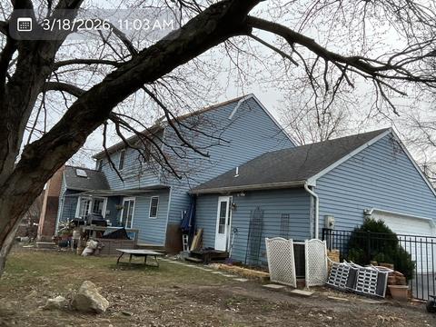 Home exterior roof behind tree — Mohnton, PA