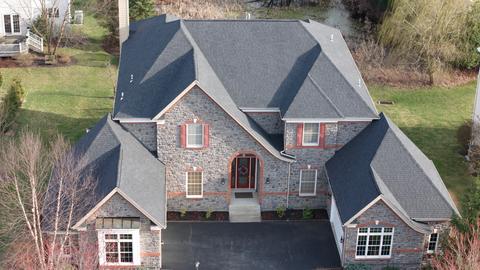 Large stone brick home roof exterior — West Chester, PA