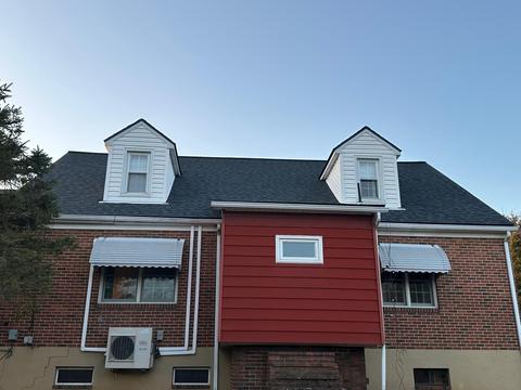 Modern board and batten siding red accent — Reading, PA
