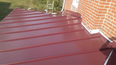 Red standing seam metal roof installation — Sinking Spring, PA