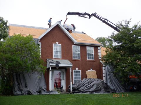 Roof shingle delivery crane brick home — Wyomissing, PA