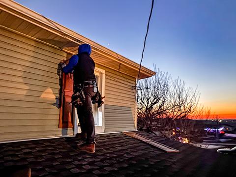 Roofers installing roof at sunset — Hamburg, PA