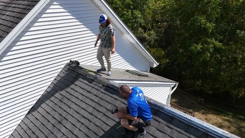 Roofing crew installing shingles at ridge — Lebanon, PA
