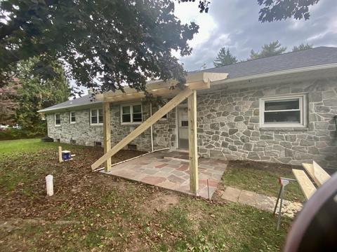 Stone home pergola patio addition — Mohnton, PA