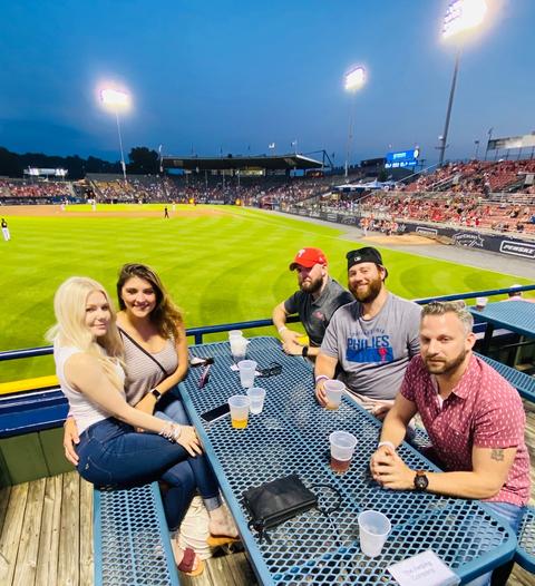 The Helping Co. team at baseball game